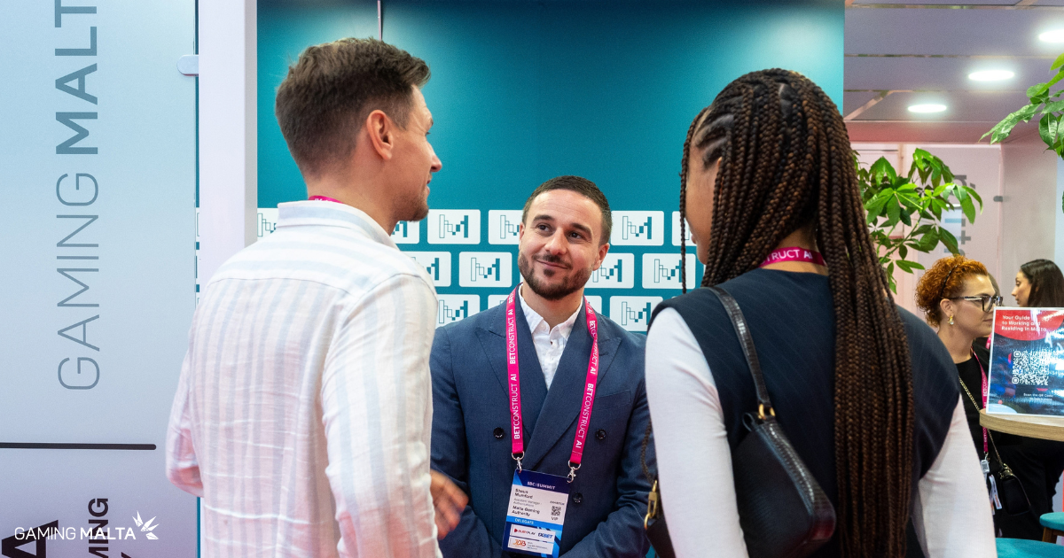 Malta representative speaking with delegates at the Make It in Malta booth