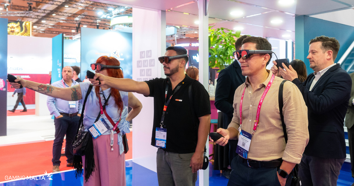 Delegates trying an immersive gaming experience at the Make It in Malta booth